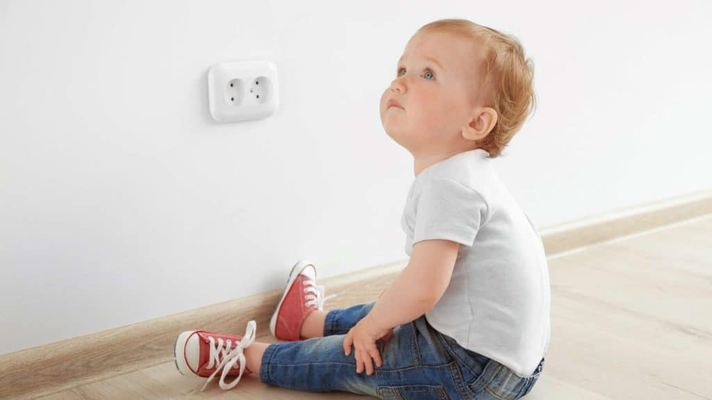 By nature, babies and children approach the world with curiosity, even if that curiosity could injure them. Electrical outlets, cords, and other home components attract children all the more when parents tell them no. How can you childproof electrical outlets, cords, and components in your home so babies and children don’t injure themselves or worse?